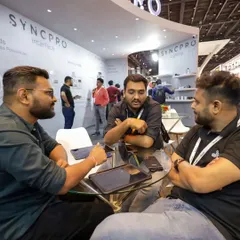 Collaboration is at the heart of what we do. Our team members meeting with partners and clients at the expo to discuss project requirements and integration possibilities.