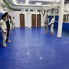A moment of respect and instruction during a seminar with Professor Erdem Gencer. Students line up to learn from a master.
