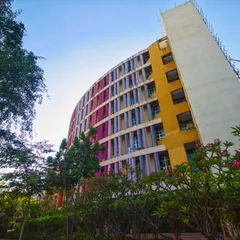 This perspective of the K.J. Somaiya College building shows its harmonious relationship with the surrounding green landscape. Our design philosophy ensures that even large urban structures are thoughtfully sited to preserve and enhance the natural environment, creating a complete and balanced campus experience.