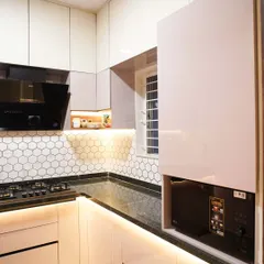 This image showcases a dedicated tall unit with a lift-up door, designed to house a microwave. This keeps the appliance off the countertop, freeing up valuable workspace.