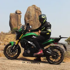 Posing with "Lucky," our green Dominar 400, at Ramanagara. The rocky landscape is a fantastic backdrop and a great short ride from the city.