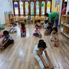 Stretching and reaching for their toes! Our yoga classes are adapted for children, focusing on flexibility, balance, and body awareness in a gentle way.