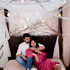 A cozy and intimate indoor shot with a canopy bed decorated with fairy lights. This setup is perfect for creating a dreamy and romantic atmosphere.