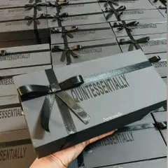 A look at the fully assembled corporate gift boxes, complete with branded ribbons. I handle every detail of the packaging to ensure a professional final product.