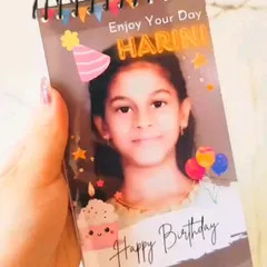 The mini photo album can also be customized for kids' birthdays, like this one with a fun and colorful "Enjoy Your Day" theme.