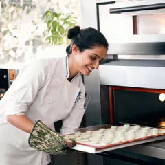 From my kitchen to yours. Here I am taking a fresh batch of macarons out of the oven. I pour my heart into every creation, ensuring the highest quality and most delicious taste.