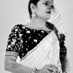 A black and white version of my Janmashtami look, focusing on the emotion and the detailed embroidery of the blouse.