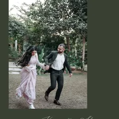 A spontaneous moment of the couple running hand-in-hand through a park. The movement in the bride's hair and their joyful expressions capture their energetic and playful spirit.