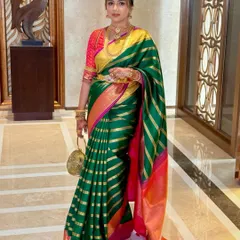 An elegant pose capturing the beautiful drape of the saree and the client's confident presence.