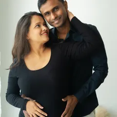 The loving gaze between a couple says everything. This intimate close-up from a lifestyle session captures the deep connection and shared joy of expecting parents.