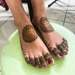 Another take on the minimalist lotus mandala for feet, this time with a delicate leafy vine extending from the side.