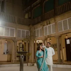 A joyful dance in the beautiful courtyard of a heritage property. The classic architecture and soft evening light create a timeless and romantic atmosphere.