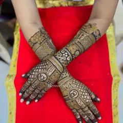 Another view of the engagement mehndi with initials and rings, showing the full design across both hands.