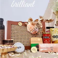 A gift should be an experience. I love curating a collection of bold, bright, and brilliant items that come together to tell a story, like this assortment featuring gourmet treats, artisanal chocolates, and fragrant wellness products.