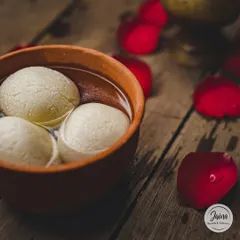 Our Sponge Rasgulla, soft and juicy, soaked in a light sugar syrup. These are incredibly light and refreshing, served chilled in an earthen bowl.