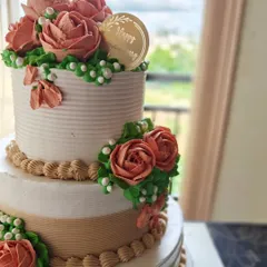 A closer look at the intricate piping work on the 25th-anniversary floral cake. Each rose is crafted with care.