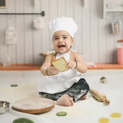 Capturing pure joy during a 'Little Chef' themed first birthday shoot. I love creating playful and unique sets like this miniature kitchen, where little ones can make a happy mess and show off their personality.
