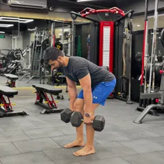 Barefoot deadlifts in the gym. Connecting with the ground helps with stability and form.