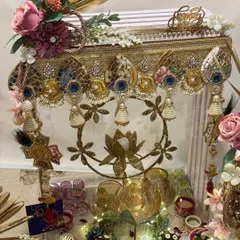 This grand Diwali hamper is a masterpiece of festive elegance. Featuring an ornate toran and a collection of beautifully packaged gifts, it's designed to be a show-stopping centerpiece for your celebrations.
