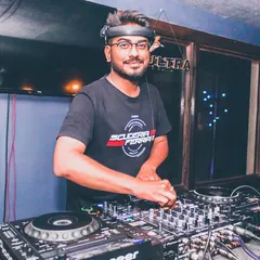 A shot from a night at the club, focused and ready. As a DJ, you have to be a masterpiece of concentration, reading the crowd and selecting the next track to keep the energy high.