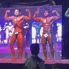 This is the moment of truth. Standing on the Mr. Asia stage, being judged against the best. My focus is absolute, a result of countless hours of posing practice.