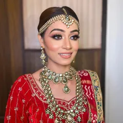 The complete royal bride look for Bhavika. Her radiant skin and timeless makeup ensured she looked stunning from every angle on her wedding day.