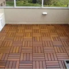 This balcony floor was transformed using our basket-weave pattern WPC deck tiles. The warm wood tone creates an inviting and comfortable outdoor space, ready for furniture and plants.