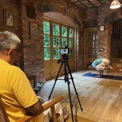 A behind the scenes look at our daily yoga marathon. While one of us teaches on camera, the other monitors the live session, ensuring a smooth and connected experience for our online community.