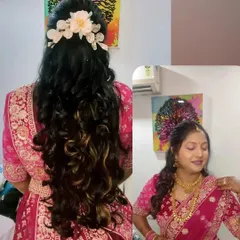 A beautiful half-up, half-down hairstyle with long, flowing curls. This style is perfect for lehengas and modern sarees.