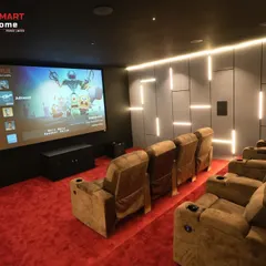 The user interface of the smart entertainment system, displayed on the big screen. Accessing Netflix, streaming services, and personal media is seamless and intuitive in this Thirunagar setup.