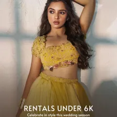 A beautiful yellow tiered lehenga perfect for a Haldi ceremony or summer wedding. This designer piece offers a fresh and vibrant look at an incredible value, making high fashion attainable.