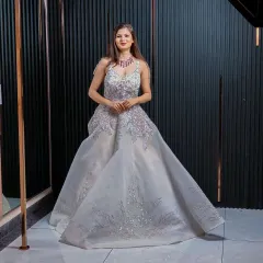 A full view of the magnificent silver gown, showcasing its grand silhouette. This is an ideal rental for making an unforgettable entrance at any formal event.