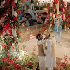 For Kahran and Gourav's Vogue-featured wedding, we designed this breathtaking mandap, using monochromatic red florals to create a powerful contrast against the Jaisalmer sandstone. This ceremony was a testament to their story, blending tradition with a bold, modern vision.