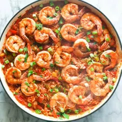 My Seafood Jambalaya is a hearty one-pan meal loaded with succulent prawns, savory sausage, and rice cooked in a rich, spicy tomato sauce. It’s a flavorful dish that is perfect for seafood lovers.
