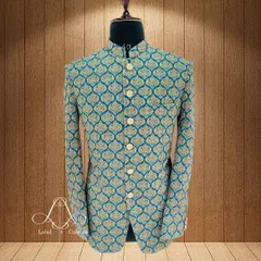 This Bandhgala jacket is crafted from a beautiful teal fabric with a golden brocade pattern. It’s a classic design that I've updated with a slim, modern fit. This piece is perfect for making a sophisticated statement at any formal event.
