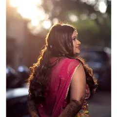 A beautiful backlit shot of the Mehendi bride. The golden hour light catches her hair and highlights her glowing skin.