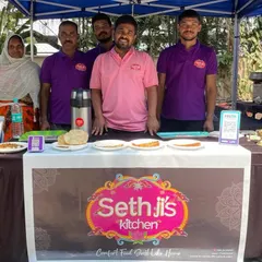 Our wonderful team, ready to serve you at a food stall. We believe that a happy team makes happy food and satisfied customers.
