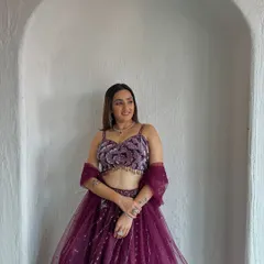 This beautiful wine-colored lehenga with a velvet floral blouse is perfect for a bridesmaid or wedding guest. It's a stylish and comfortable choice.
