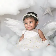 Another precious moment from my angel-themed newborn shoot. The soft lighting and dreamy cloud background create a heavenly portrait of this sweet baby.