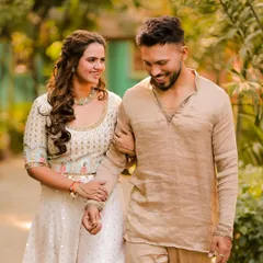 A great wedding look is about balance. Here, the groom's modern textured crop complements the bride's soft waves, creating a cohesive and stylish appearance for the couple.