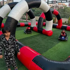 Here are some young guests enjoying the go-kart experience. The karts are easy to operate, and the track provides plenty of room for fun, supervised racing.