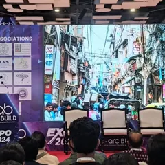 Presenting a keynote at the D-Arc Build Expo, with an image of a dense urban streetscape on the screen behind me. My talks often focus on the potential for community-led revitalization in complex urban environments.