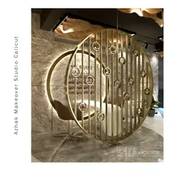 Detail of the nail studio within Azhak Makeover Studio. This sculptural, back-lit partition acts as both a functional display for products and a stunning art piece, demonstrating how I integrate brand needs into unique architectural features.