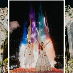 A burst of color and joy as the couple celebrates their union. This shot, with vibrant smoke against the night sky, captures the high energy and celebratory spirit of a modern Indian wedding.