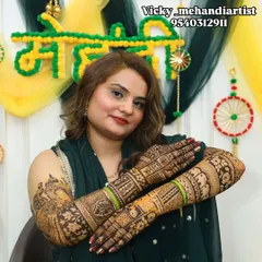 This bride looks absolutely radiant, proudly displaying her stunning bridal mehndi.