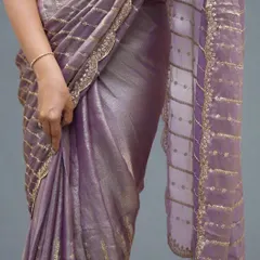 A close-up of the beautiful scallop edging and sequin work on our lavender organza tissue saree. The details are what make this affordable saree look so elegant.