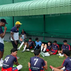 A tactical discussion on the sidelines with our U17 squad. Our experienced coaches provide detailed feedback to help players understand the strategic side of the game.