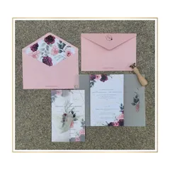 This design pairs the softness of blush pink with the richness of burgundy. The floral illustrations on the vellum wrap and envelope liner create a romantic and cohesive look, perfect for a modern wedding.