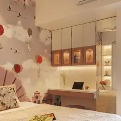 A view of the integrated study area in the kids' room. The overhead cabinets feature charming arched glass doors, providing storage that is both functional and decorative.