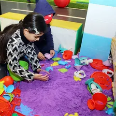 Let their creativity flow in our kinetic sand pit. It's a mess-free way for kids to build, mold, and play.